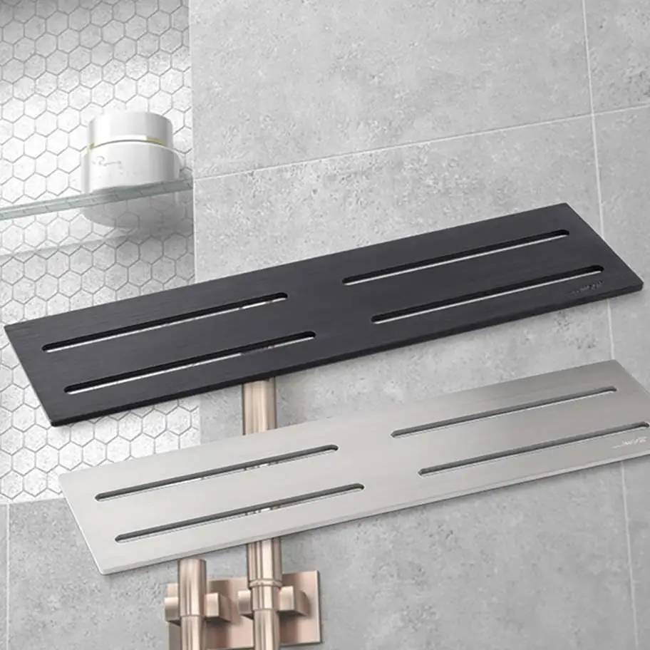 Linear shower drain covers in black and stainless steel for modern bathrooms